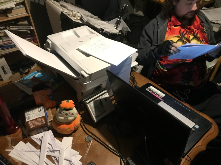 Del reading a test print while the 15000 churns out interiors